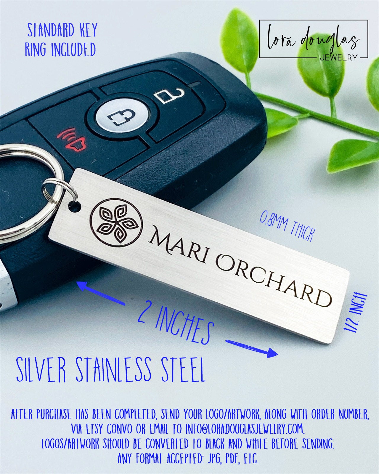 A silver stainless steel keychain with a custom logo engraving
