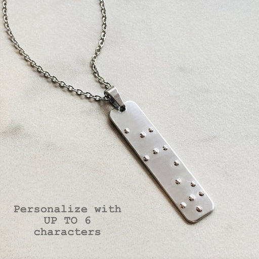 Key ring with the 6 braille dots on it