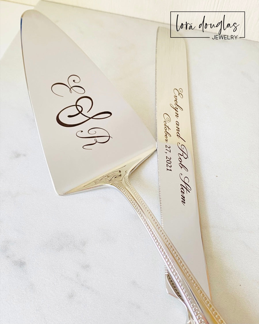 A stainless steel cake knife and server personalized with laser engraved initials and names for wedding cake cutting ceremony 