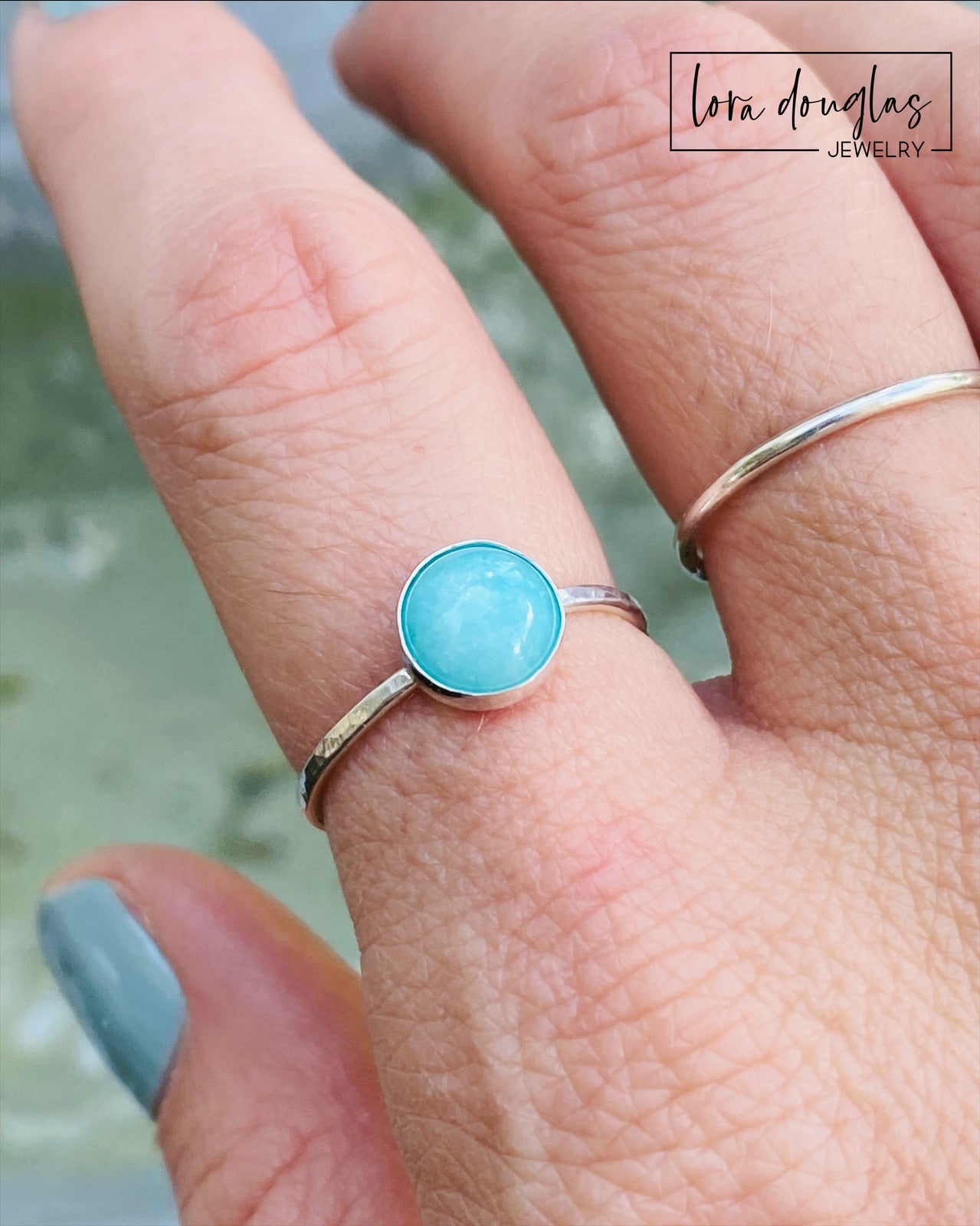 A sterling silver ring with a blue amazonite stone, set in a classic bezel setting.