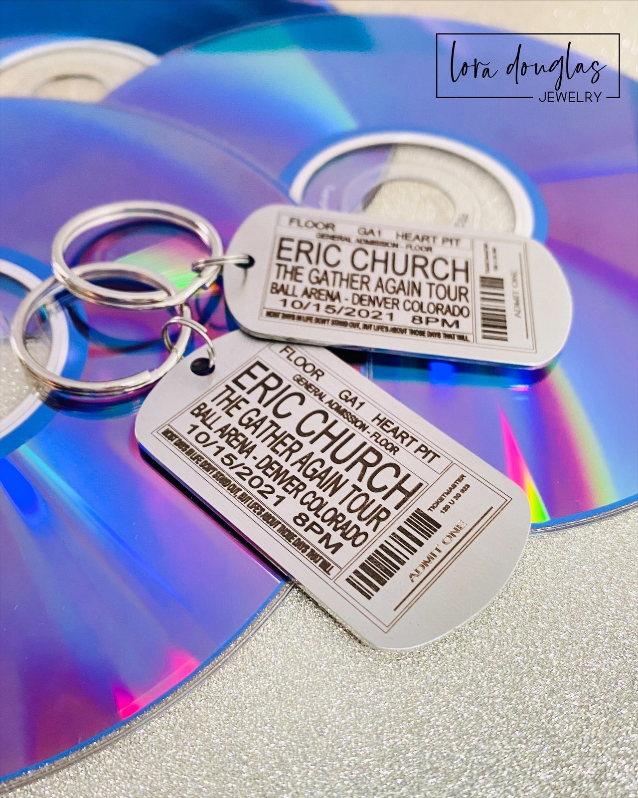 Capture your favorite concert memories with this playful dog tag style keychain, custom engraved to mimic your ticket stub from any band, concert, or event.