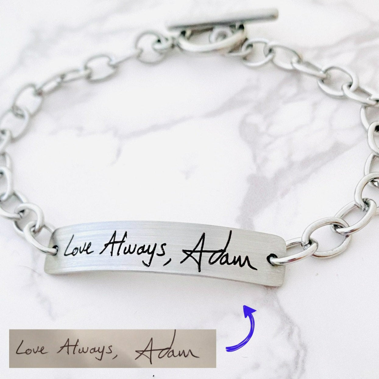 A stainless steel bracelet with engraved handwriting