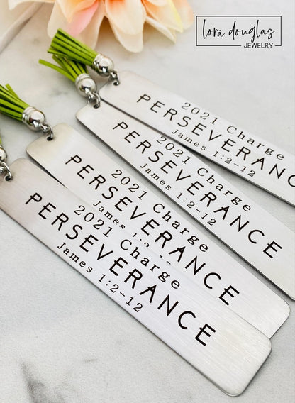 engraved bible verse bookmark displayed flat beside prayer journal and Bible, stainless steel christian bookmark personalized with scripture quote and custom engraving for Bible study gifts