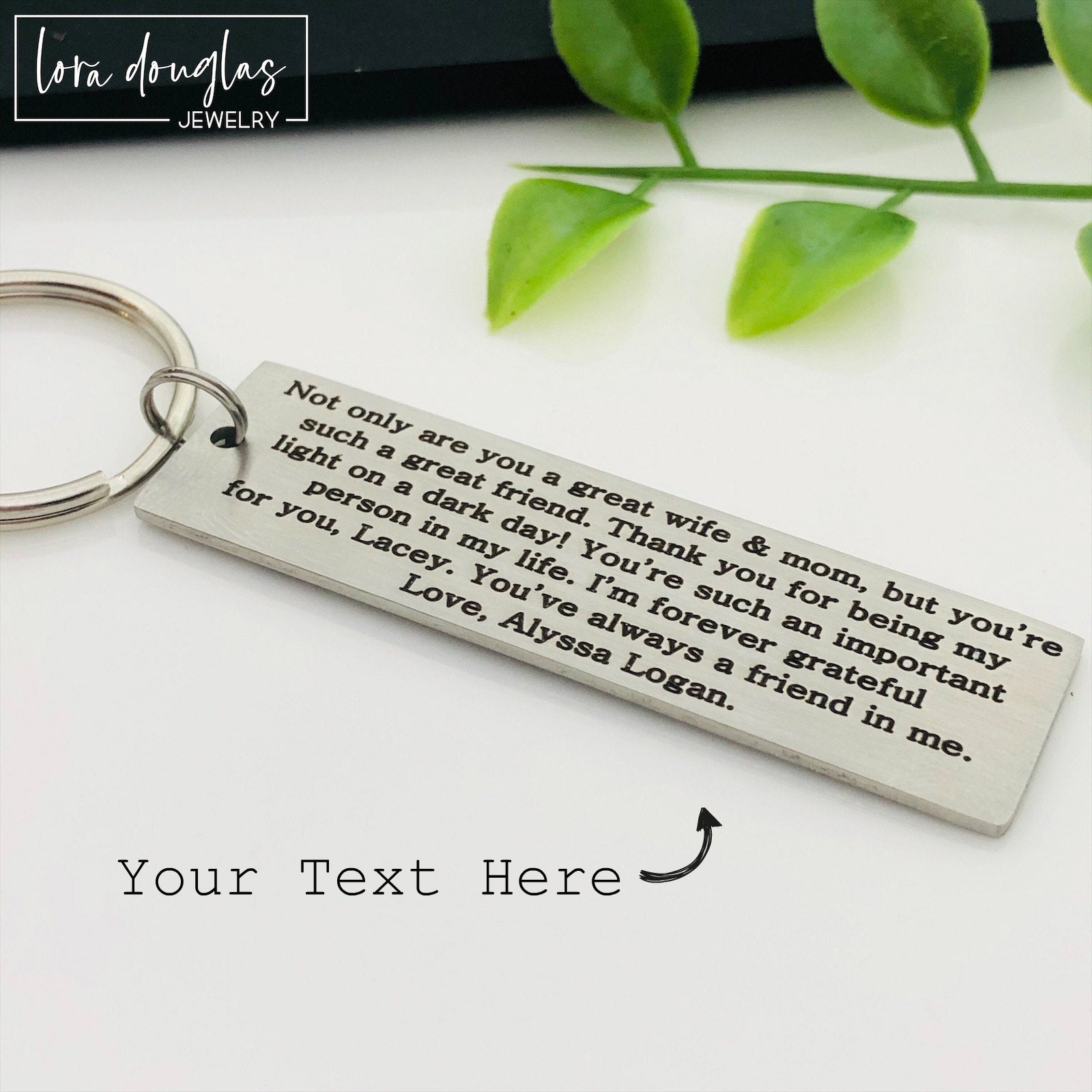 silver metal keychain with custom Bible verse engraved