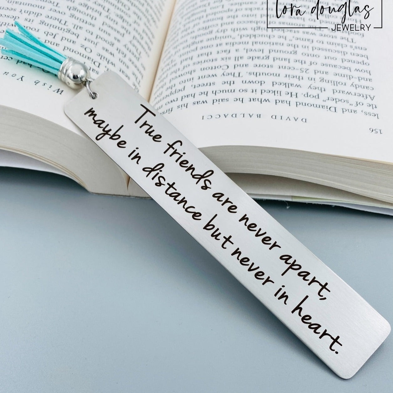 stainless steel friendship bookmark engraved with True Friends Are Never Apart message, meaningful long distance friendship gift with leather tassel and permanent laser engraving detail